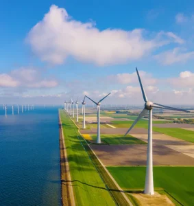 Windmill park in the ocean aerial view with wind turbines